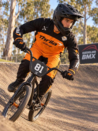THRILA Papaya BMX racewear on a rider