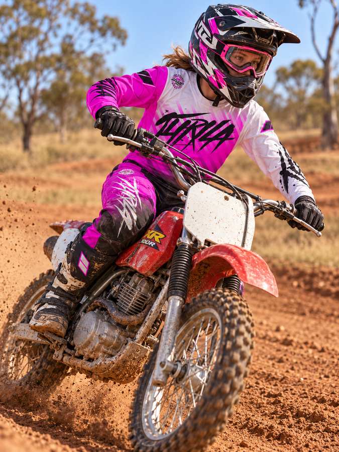 THRILA Vulcan Pink Motocross racewear on a rider