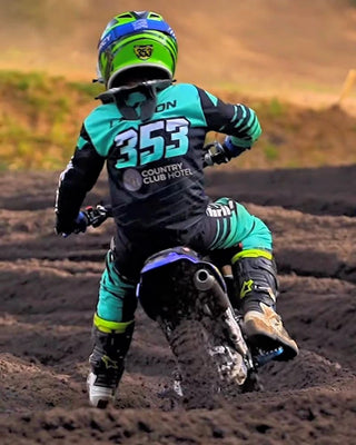 THRILA Cool Mint Motocross racewear on a rider